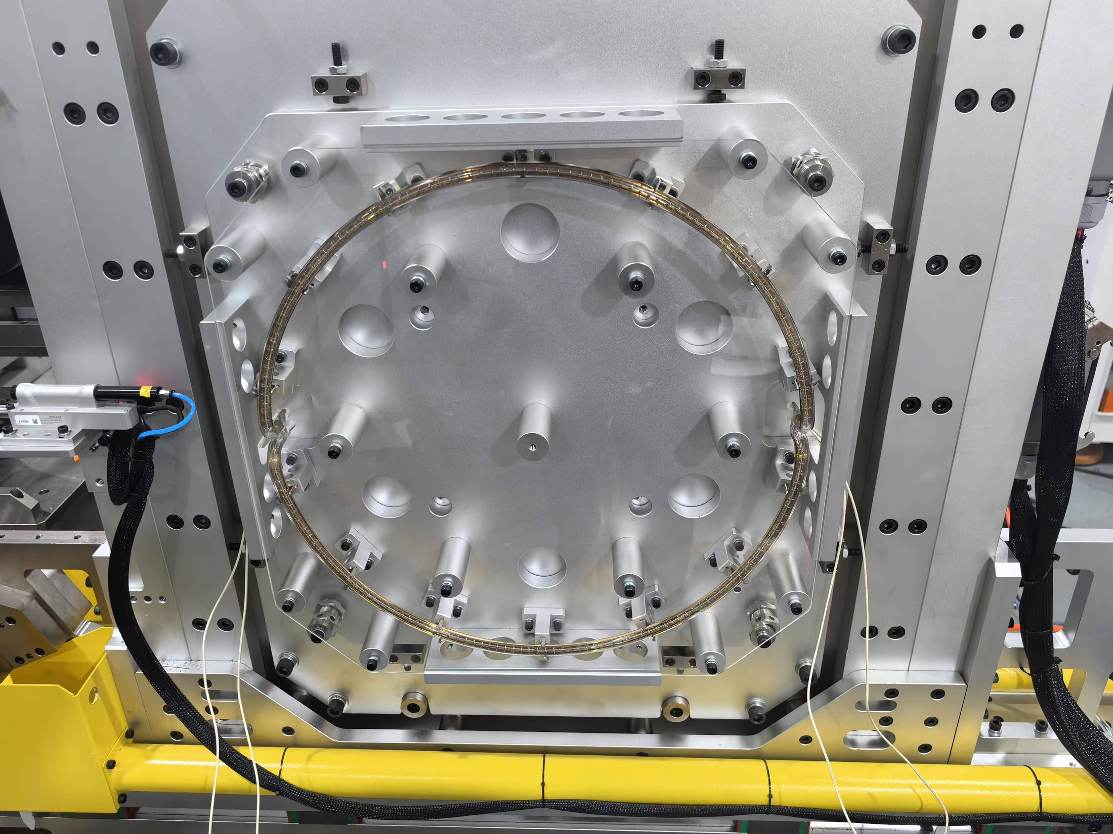 Circular custom infrared heating element installed in industrial tooling
